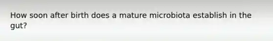 How soon after birth does a mature microbiota establish in the gut?