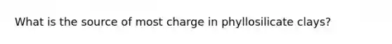 What is the source of most charge in phyllosilicate clays?