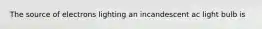 The source of electrons lighting an incandescent ac light bulb is