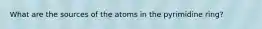 What are the sources of the atoms in the pyrimidine ring?