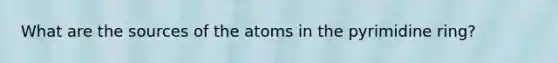 What are the sources of the atoms in the pyrimidine ring?