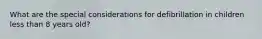 What are the special considerations for defibrillation in children less than 8 years old?