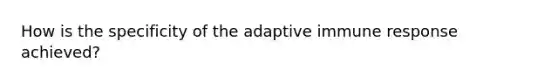 How is the specificity of the adaptive immune response achieved?