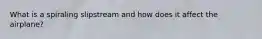 What is a spiraling slipstream and how does it affect the airplane?
