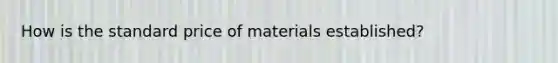 How is the standard price of materials established?