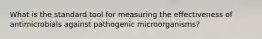 What is the standard tool for measuring the effectiveness of antimicrobials against pathogenic microorganisms?