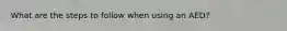 What are the steps to follow when using an AED?