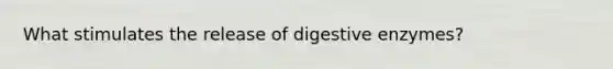 What stimulates the release of digestive enzymes?