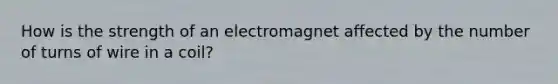 How is the strength of an electromagnet affected by the number of turns of wire in a coil?