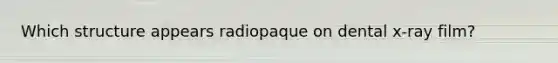 Which structure appears radiopaque on dental x-ray film?
