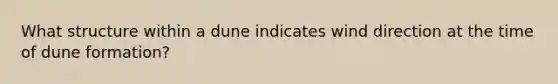 What structure within a dune indicates wind direction at the time of dune formation?