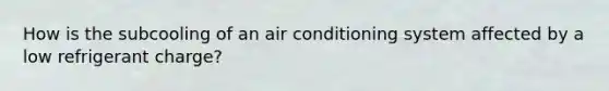 How is the subcooling of an air conditioning system affected by a low refrigerant charge?