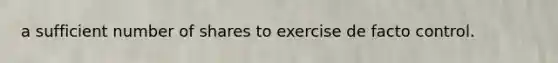 a sufficient number of shares to exercise de facto control.