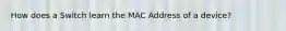 How does a Switch learn the MAC Address of a device?