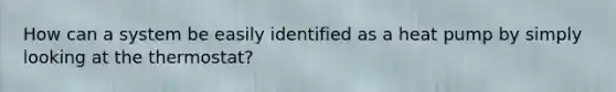 How can a system be easily identified as a heat pump by simply looking at the thermostat?