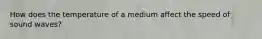 How does the temperature of a medium affect the speed of sound waves?