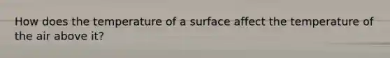 How does the temperature of a surface affect the temperature of the air above it?