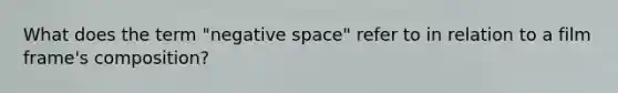 What does the term "negative space" refer to in relation to a film frame's composition?