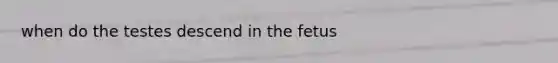 when do the testes descend in the fetus