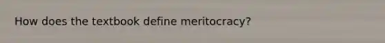 How does the textbook define meritocracy?