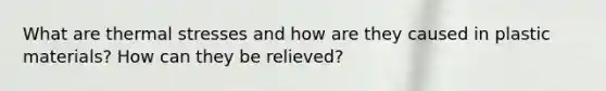 What are thermal stresses and how are they caused in plastic materials? How can they be relieved?