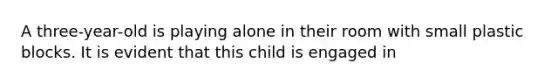 A three-year-old is playing alone in their room with small plastic blocks. It is evident that this child is engaged in