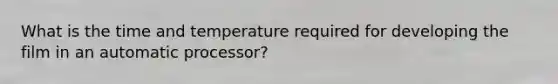 What is the time and temperature required for developing the film in an automatic processor?