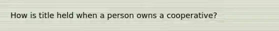 How is title held when a person owns a cooperative?