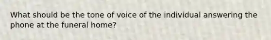 What should be the tone of voice of the individual answering the phone at the funeral home?