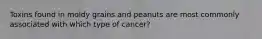 Toxins found in moldy grains and peanuts are most commonly associated with which type of cancer?