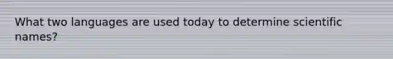 What two languages are used today to determine scientific names?