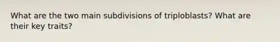 What are the two main subdivisions of triploblasts? What are their key traits?