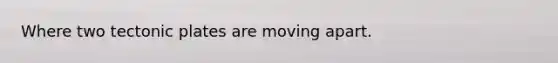 Where two tectonic plates are moving apart.