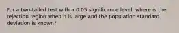 For a two-tailed test with a 0.05 significance level, where is the rejection region when n is large and the population standard deviation is known?