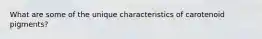 What are some of the unique characteristics of carotenoid pigments?
