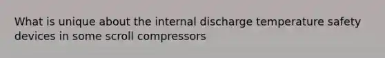 What is unique about the internal discharge temperature safety devices in some scroll compressors