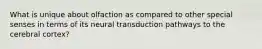 What is unique about olfaction as compared to other special senses in terms of its neural transduction pathways to the cerebral cortex?