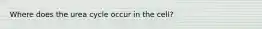 Where does the urea cycle occur in the cell?