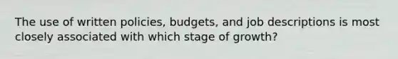 The use of written policies, budgets, and job descriptions is most closely associated with which stage of growth?