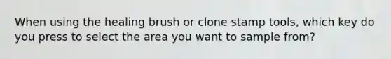 When using the healing brush or clone stamp tools, which key do you press to select the area you want to sample from?