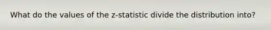 What do the values of the z-statistic divide the distribution into?