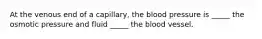 At the venous end of a capillary, the blood pressure is _____ the osmotic pressure and fluid _____ the blood vessel.