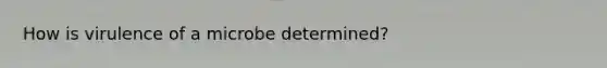 How is virulence of a microbe determined?