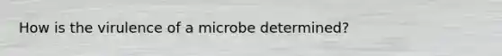 How is the virulence of a microbe determined?