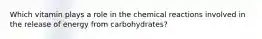 Which vitamin plays a role in the chemical reactions involved in the release of energy from carbohydrates?