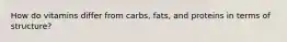 How do vitamins differ from carbs, fats, and proteins in terms of structure?