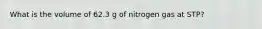 What is the volume of 62.3 g of nitrogen gas at STP?