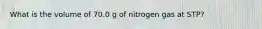 What is the volume of 70.0 g of nitrogen gas at STP?