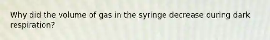 Why did the volume of gas in the syringe decrease during dark respiration?
