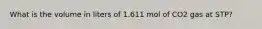 What is the volume in liters of 1.611 mol of CO2 gas at STP?